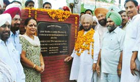 Mr Lal Singh, Rural Development and Panchayat, Irrigation and Power Minister, Punjab, laying the foundation stone of a bridge at Sidhwan Canal at Gill Road in Ludhiana on Wednesday.