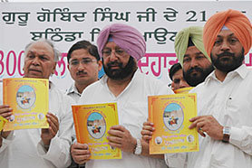 Punjab Chief Minister Capt Amarinder Singh (centre) releases a souvenir relating to the tercentenary celebrations of Guru Gobind Singhs visit to Bathinda on Wednesday.