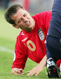 Englands Michael Owen receives treatment on the pitch during their Group B match against Sweden in Cologne on Tuesday.