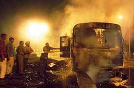 Firemen try to douse the flames after a tipper caught fire in Mohali on Thursday