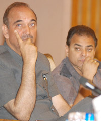 The Chief Minister, Mr Ghulam Nabi Azad, (left) listens to a speaker at the Editors Conference in Srinagar on Thursday. The Union Minister for Rural Development, Dr Raghuvansh Prasad Singh, was also present. 