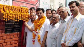 Mr Madan Lal Bagha, Municipal Councillor, Ward No. 4, inaugurates the street paving work in his area in Ludhiana on Thursday