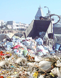 Such garbage heaps can vanish once plastic waste is used for making roads.