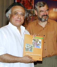 The Indian Minister of State for Commerce, Mr Jairam Ramesh holds a copy of the newly released World Bank Report