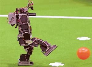 A robot called Jaldee takes a penalty during a match in Bremen, Germany