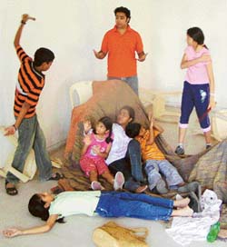 Zubin teaching theatre exercies to participants at a workshop. 