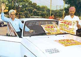 Mr V.P. Singh, president of the Netaji Subhas Foundation, who is leading a chetna yatra to educate people about the findings of the Justice Mukherji Commission of Inquiry on circumstances related to the disappearance of Netaji Subhas Chandra Bose, waves while passing through Chandigarh