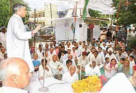 The Minister of State for Finance, Mr Pawan Bansal, addresses residents of Deep Complex at Hallo Majra in Chandigarh on Sunday