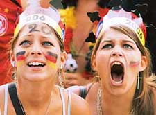 German fans scream as they watch the match between Germany and Sweden in Berlin on Saturday