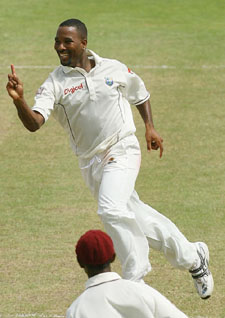 Corey Collymore of the West Indies celebrates after taking the wicket of Virender Sehwag on the third day of the third Test in St Kitts on Saturday