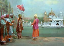 A diorama depicts Maharaja Ranjit Singh supervising the gold-plating of the Golden Temple.