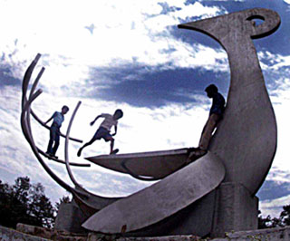 Children enjoy change in weather by playing on a sculpture in Sector 10, Chandigarh.