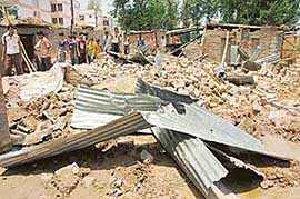 Enforcement staff of MC demolished illegal structure at Colony No 5 in Sector 50, Chandigarh on Wednesday.