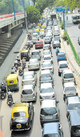 Motorists wait for the Prime Minister to pass in Delhi cantonment in the Capital 