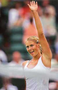 Russias Maria Sharapova celebrates after beating Israels Anna Smashnova at Wimbledon on Wednesday. Sharapova won 6-2, 6-0. 