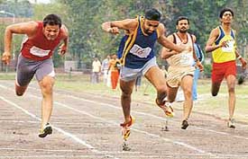 Pardeep Singh of HSEB finishes first in the 100 metre race in All-India electricity athletic meet at Sports Complex, Sector 7 on Thursday