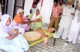 Paramjit Kaur, mother of deceased Gurpreet, lies unconscious at her house in Lehal village near Ahmedgarh