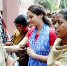 Monika Bedi, former film actress and girlfriend of prime accused in Bombay blasts, Abu Salem, is escorted by the police outside a court in Hyderabad on Thursday.