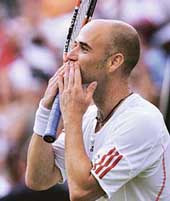 Andre Agassi of the USA celebrates after beating Italys Andreas Seppi in the second round at Wimbledon in London on Thursday. Agassi won 6-4, 7-6, 6-4.