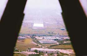 This picture taken from the navigators console of an IL-76 just before touchdown at Chandigarh shows heavy construction adjacent to the perimeter wall of the Air Force Station