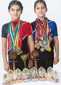 Sirjana Dhaliwal and Tamanna Mann with their trophies