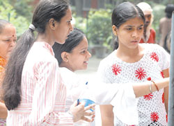 Anxious candidates scanning the second cut-off list at a college in Delhi University in the Capital