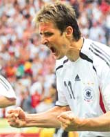 German forward Miroslav Klose celebrates after scoring the equaliser against Argentina in the World Cup quarterfinal at Berlins Olympic Stadium on Friday. Germany won 4-2 on penalties