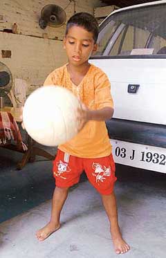 Five-year-old Budhia, who has entered the Limca Book of Records in the 65-km marathon, plays with a ball near the NIS in Patiala on Friday.