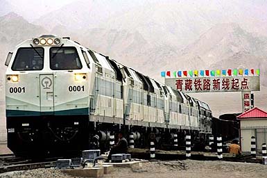 A train is seen near a board declaring the starting point of the Qinghai-Tibet railway at the Golmud Station