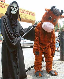 An activist of the People for Ethical Treatment to Animals  protests on the first day of the International Leather Fair in New Delhi 