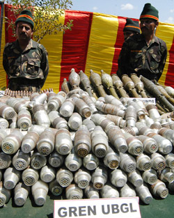The Army displays seized arms and ammunition at a base camp at Phanjgam