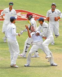 Rahul Dravid, Yuvraj Singh, M.S. Dhoni and Mohammad Kaif celebrate with S Sreesanth after the fall of Brian Laras wicket on the second day of the fourth Test in Kingston