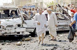 A scene of a car bomb blast in a busy market in Baghdads Sadr City neighbourhood in Iraq 