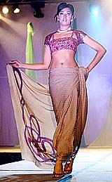 A model showcases a creation by Indian designer at the 24th AAPI convention in Atlanta