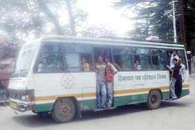 An overloaded HRTC bus plying from Annadale to Sanjauli in Shimla on Sunday. 