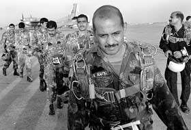 File picture of para-troopers lining up to board their aircraft for a night para-drop