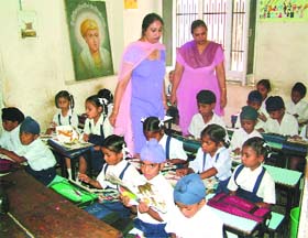 Children from poor families study during a class at Sri Guru Harkrishan Charitable Public School in Amritsar