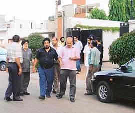 People outside the residence of Vikramjit Singh at Ludhiana on Wednesday.