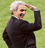 French coach Raymond Domenech celebrates after his team beat Portugal 1-0 in the semifinal in Munich on Wednesday; Frances Zinedine Zidane.