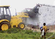 A demolition drive by PUDA in progress at Jagatpura village near Mohali on Friday