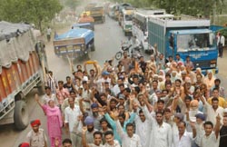Heavy vehicles make a beeline blocking the traffic on the GT Road at Kartarpur in Jalandhar 