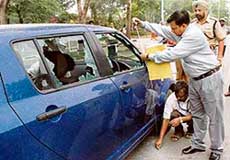 Ballistic experts from the Central Forensic Science Laboratory (CFSL) examine the spot where notorious gangster Prabhjinder Singh Dimpy was shot dead in a Maruti Swift car on Friday night. 
