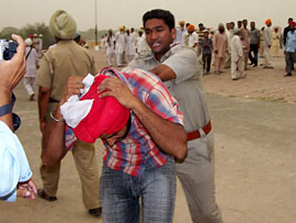 The police rounds up protesting unemployed BEd teachers at a public meeting held by the Congress in Rampura Phul on Sunday. 