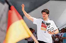 German captain Michael Ballack waves to team supporters at the Fan Fest in Berlin on Sunday. 