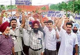 ITI employees protest to press for acceptance of their demands in front of Government ITI at Phase V, Mohali, on Wednesday. 