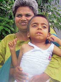 After being abandoned by his father, seven-year-old Mohit has found comfort in the embrace of Raaj, also a destitute at Pingalwara, Palsora.