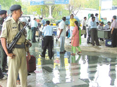 Police personnel standing watch at Indira Gandhi International Airport on Wednesday. 