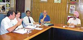 PAU Vice-Chancellor Dr KS Aulakh discusses technology for converting paddy straw and wheat straw into biogas with Dr BS Pathak and Austrian delegates at PAU in Ludhiana on Wednesday. 
