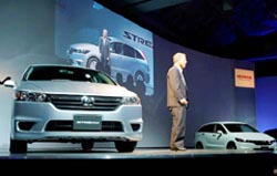 Honda Motor Co President Takeo Fukui speaks as he unveils the Japanese automaker's second-generation minivan Stream at a press conference in Tokyo