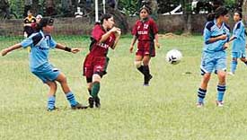 Delhi and Maharashtra in action during a Junior Girls National Football Championship match at Punjab Engineering College on Thursday. 